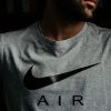 man in gray and black nike crew neck t-shirt