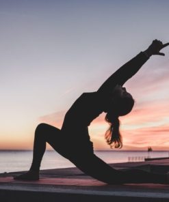 silhouette photography of woman doing yoga