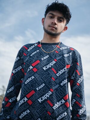 man in black and white tribal sweater