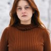 woman in brown turtleneck sweater